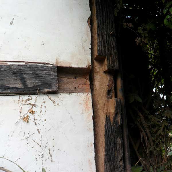 removing-damaged-surface-of-timber-frame