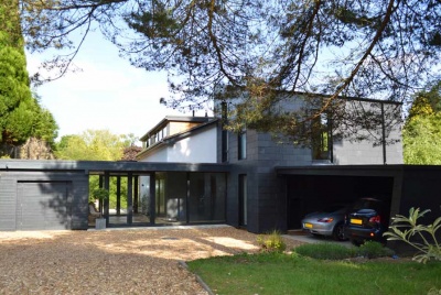 Extension and renovation of 1960s detached home in Haslemere, Surrey featuring dualaspect entrance hall.