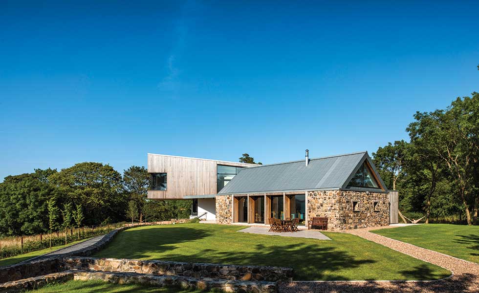 As part of the conversion of the stone barn on site, a dramatic cantilevered bedroom wing extension has also been added to create the space the homeowners need