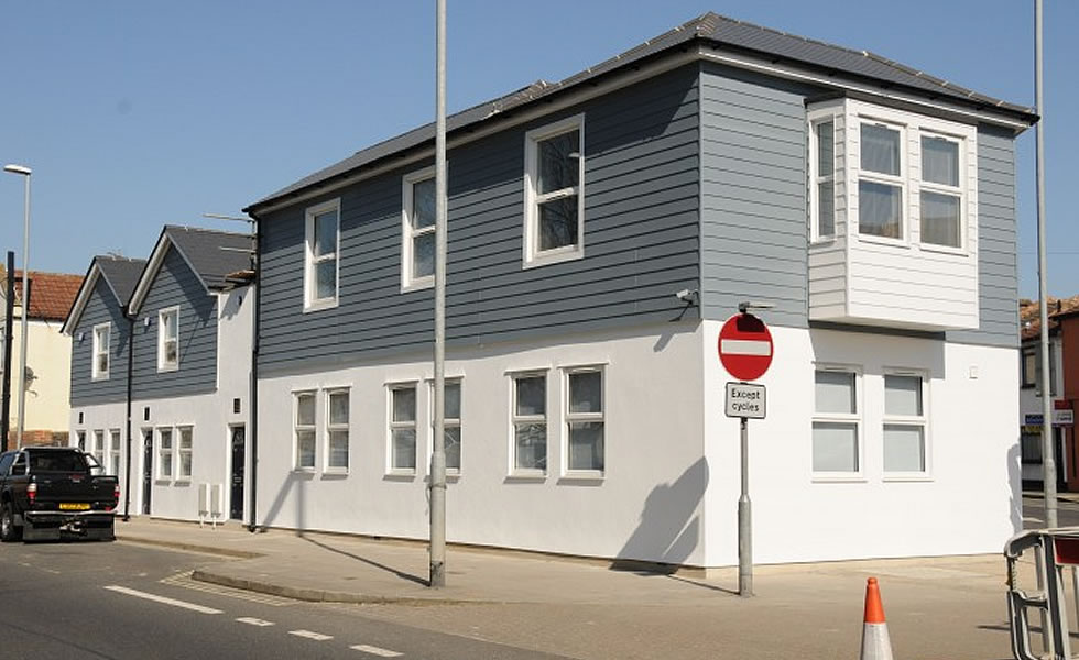 Weatherboard cladding range in Colonial Blue and White used for South Hants Property Service development
