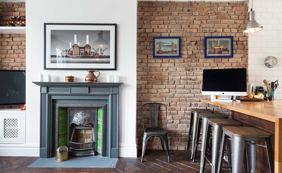 Open plan kitchen diner with original fireplace