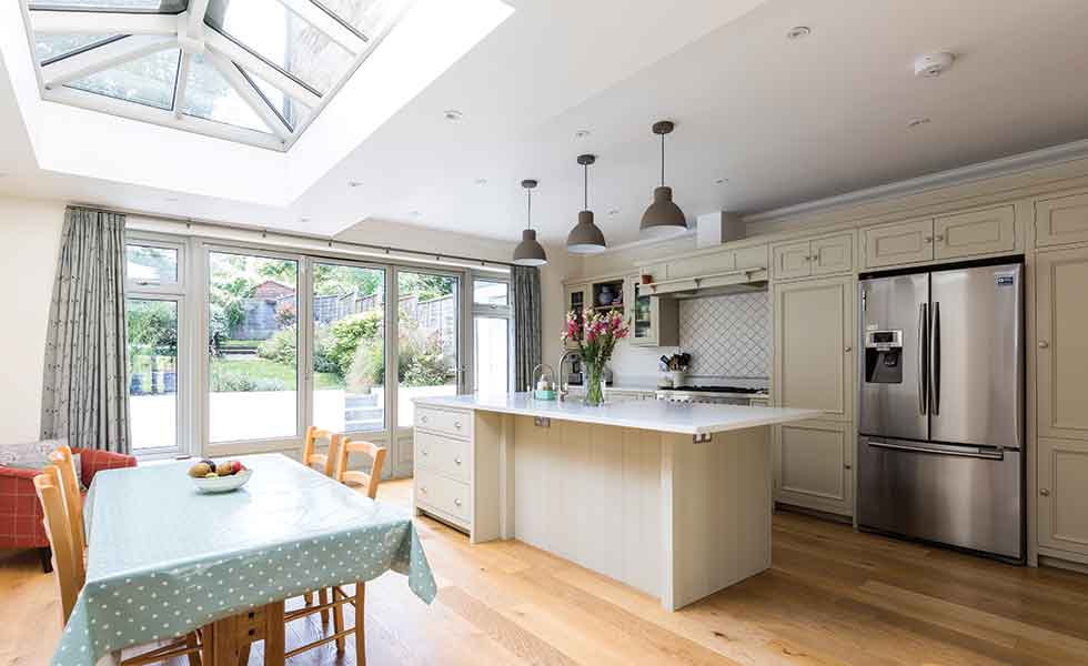 The new extension by Design Squared made way for a new kitchen diner lit from above by a roof lantern as well as bi-fold doors