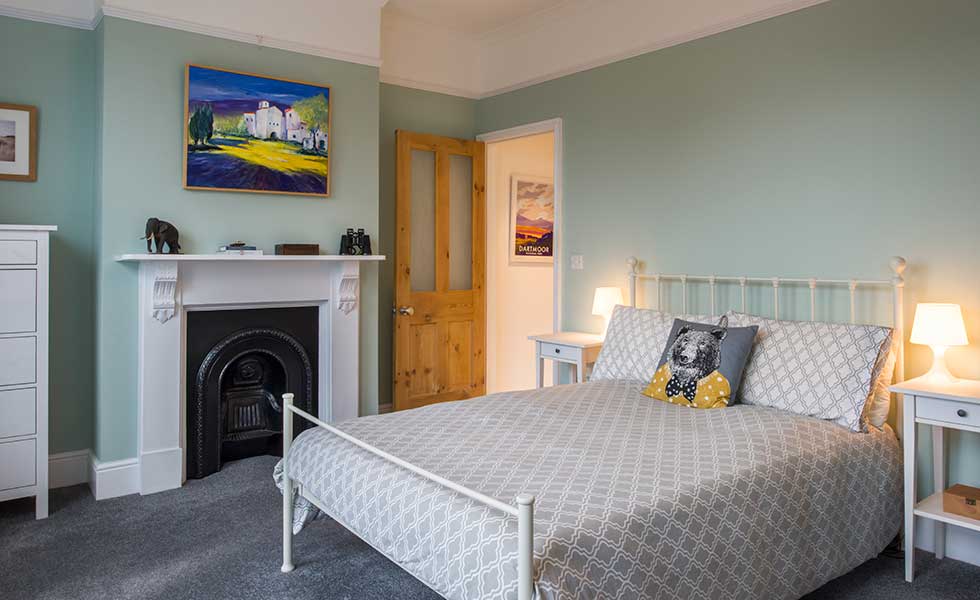 Original cast iron fireplace in bedroom