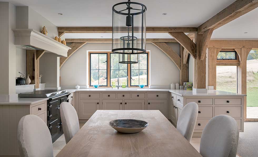 Shaker kitchen with exposed timber beams