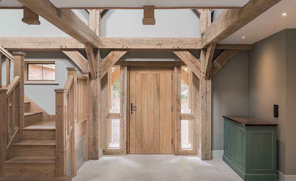 Entrance hall with oak staircase and exposed oak beams