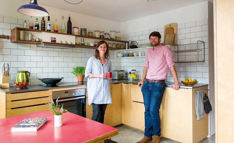 Clare Williamson and Oscar Baldry in their budget kitchen in a small eco home