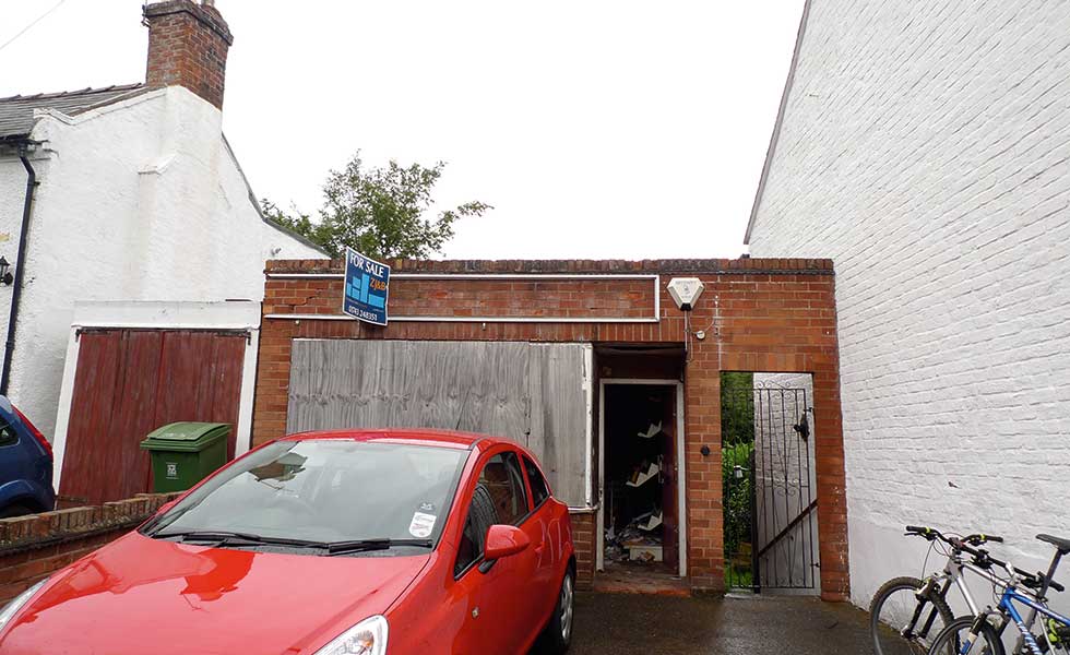 a newsagents boarded up before being converted into a small home