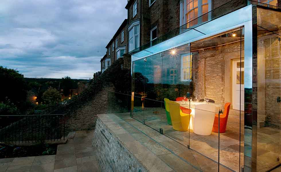 This glass box extension to a period property provides a new dining room