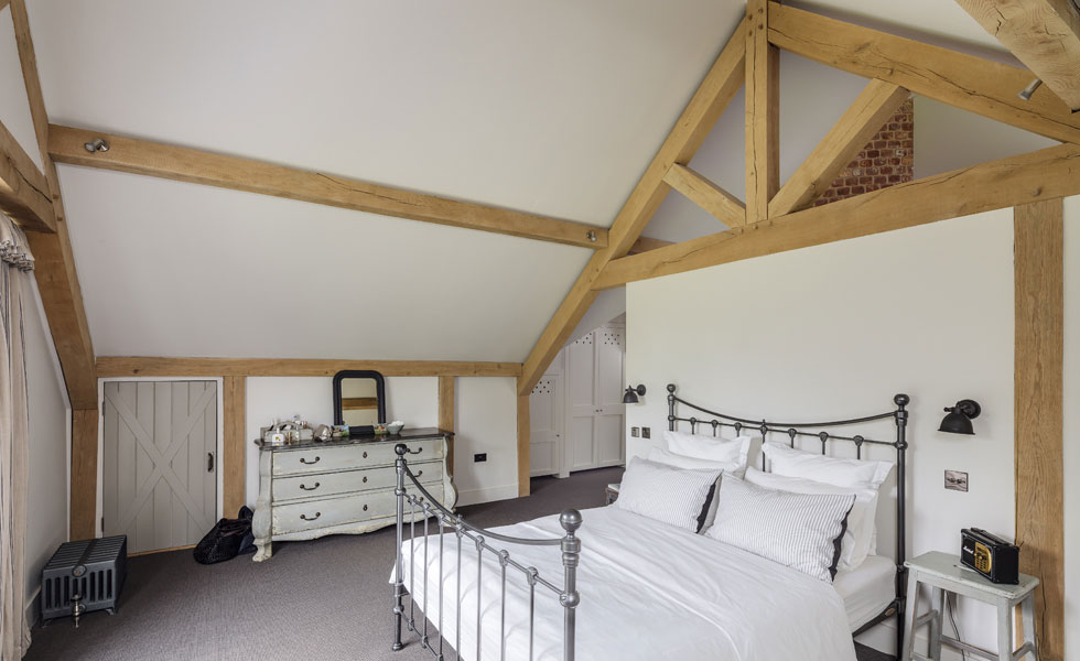 The master suite has views across the garden and a Juliette balcony