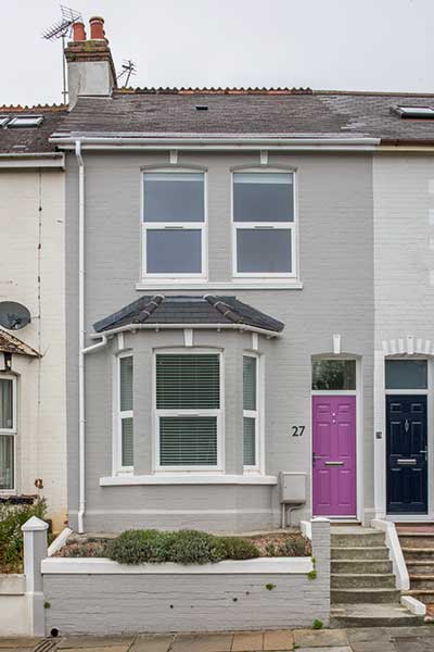 Mid terrace house painted grey