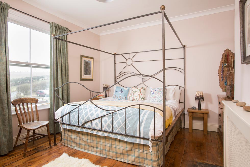 Four poster bed in extension of Georgian farmhouse