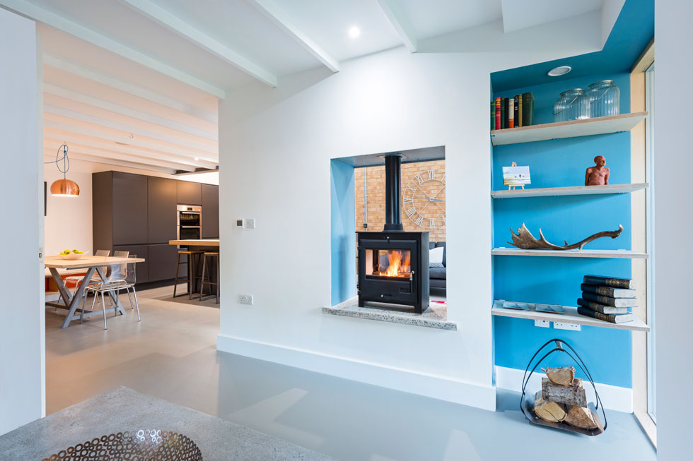 Double sided fireplace with woodburning stove