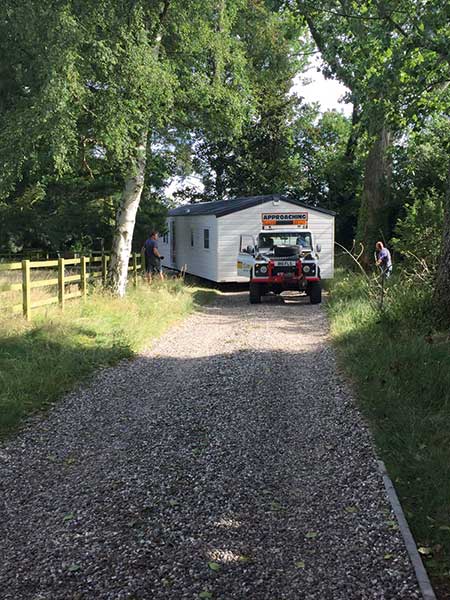 This caravan is being brought to site using a 4x4 car
