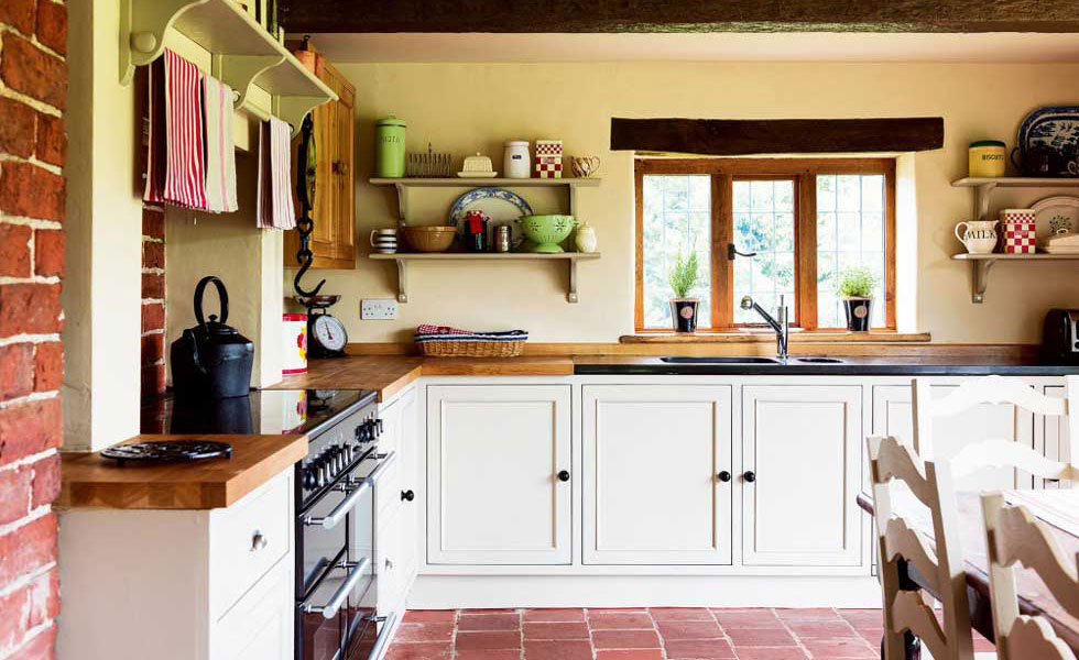 tudor style kitchen red clay tile floor