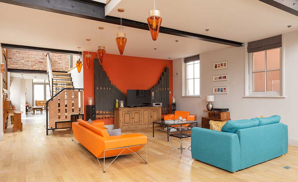 Living room in chapel conversion with double height ceilings