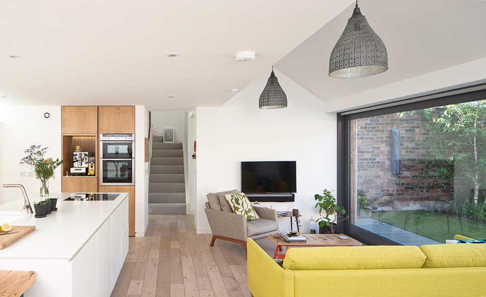open-plan-kitchen-diner-opening-to-garden