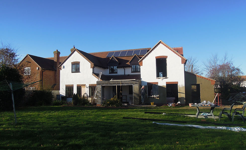 giant extension white render scaffolding flat roof