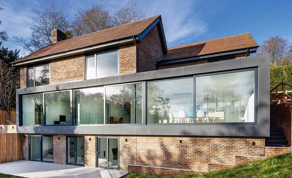 This two storey extension designed by AR Design Studio adds contemporary flair to a traditional brick building