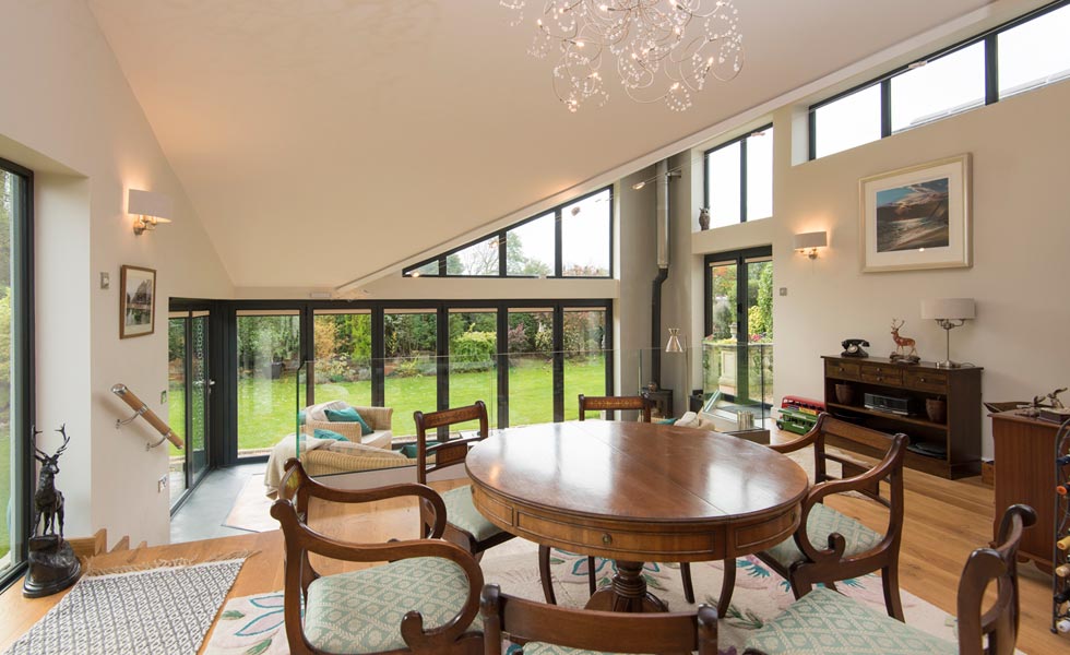 Corner bi-fold doors with integral blinds from Origin