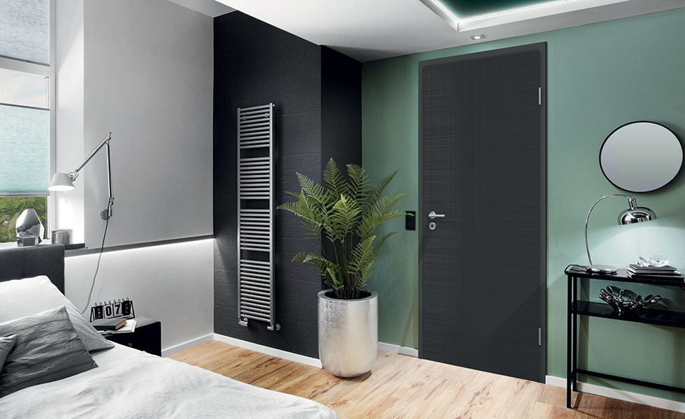 modern black door in contemporary bedroom