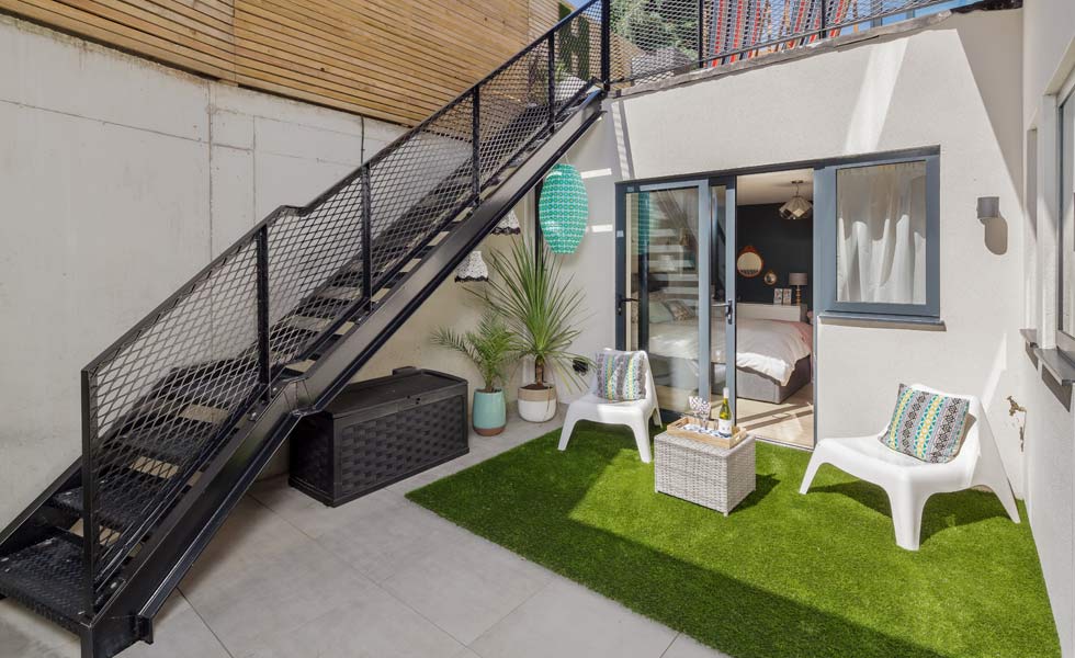 industrial style stairs down to basement level courtyard