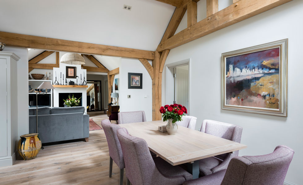 exposed oak frame and lime-washed oak floor in dining room