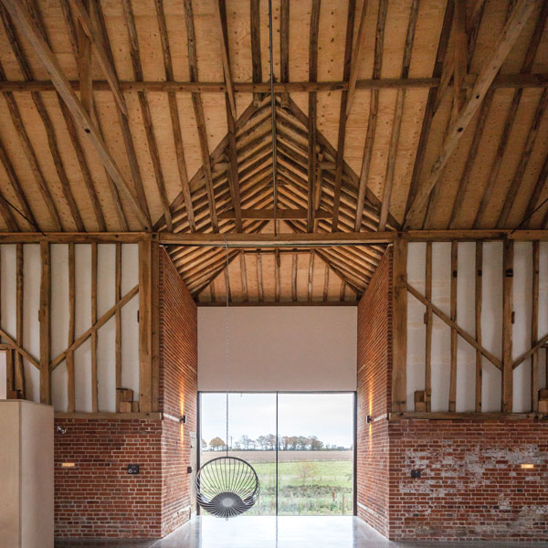 Bespoke glazing was chosen to make the most of the former entrance in this barn conversion