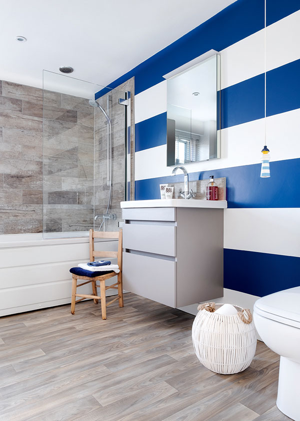white bathroom with blue and white feature wall