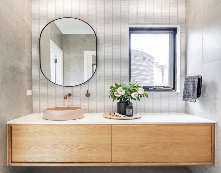 Wood panelling in bathroom with countertop basin