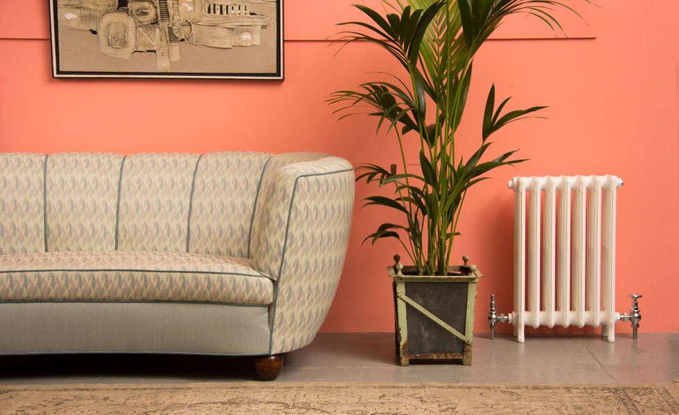 Column radiator in pink living room