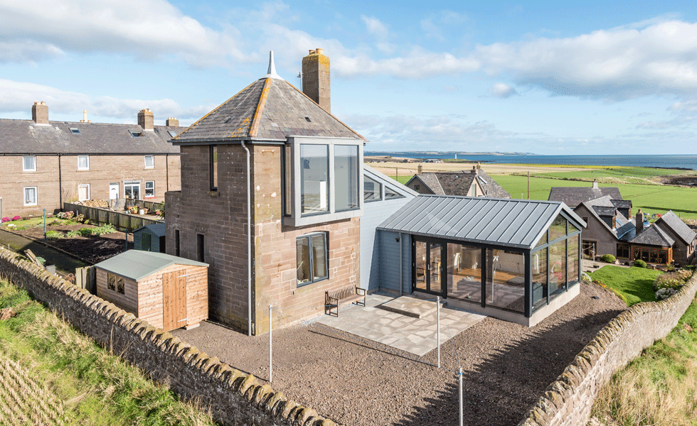 tower home with large windows