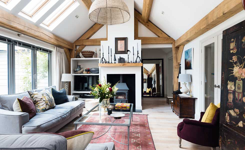 The fireplace and placement of the furniture help to zone the living room in this predominantly open plan ground floor layout