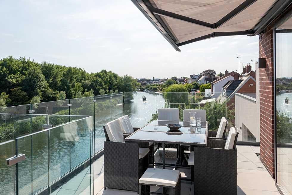 The balcony overlooks the river