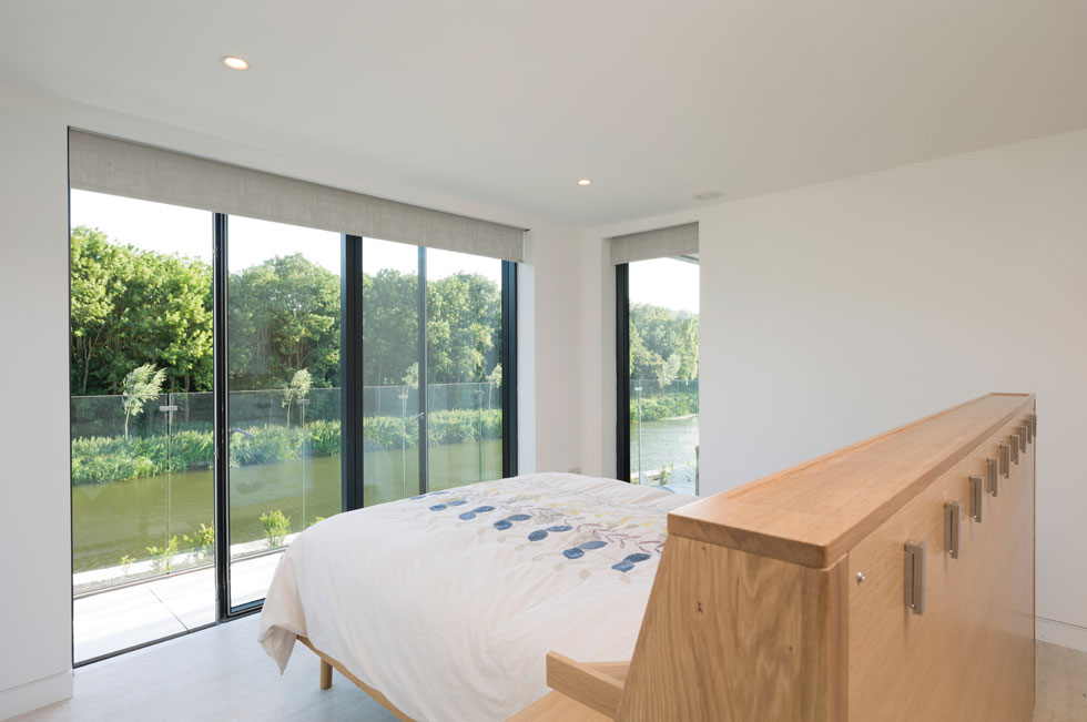 The master bedroom overlooks the river