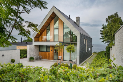 Contemporary house with slate, timber and render cladding