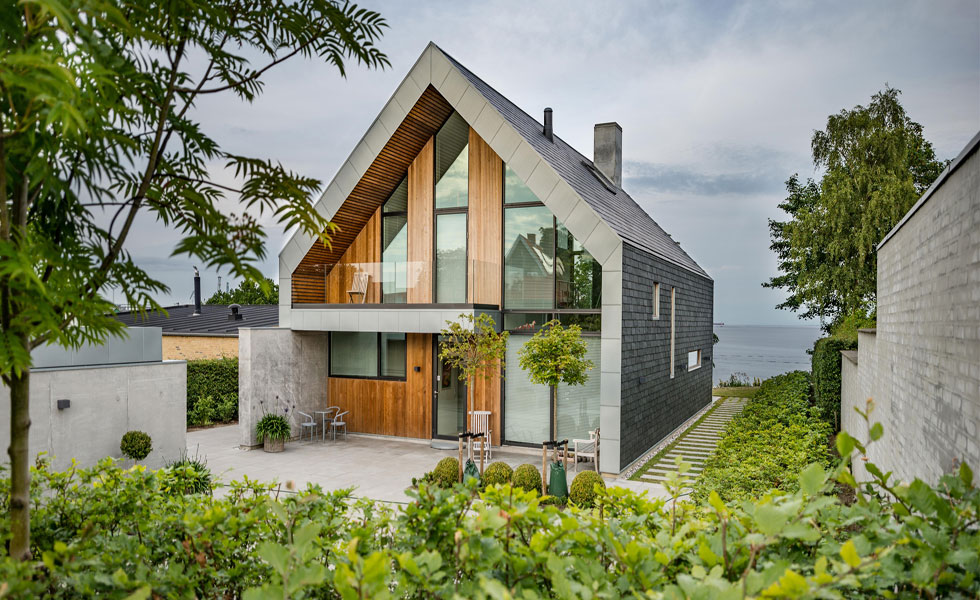 Contemporary house with slate, timber and render cladding