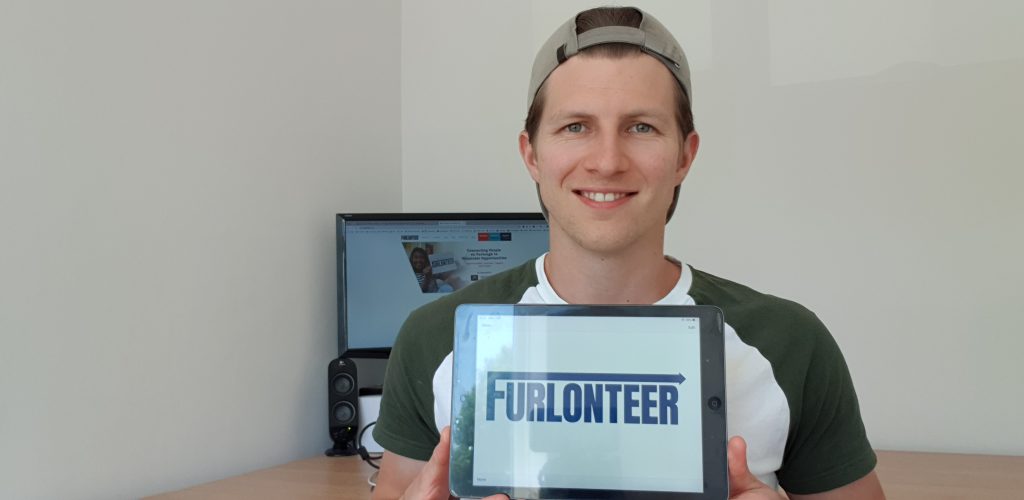 Ian Holden holding the Furlonteer logo