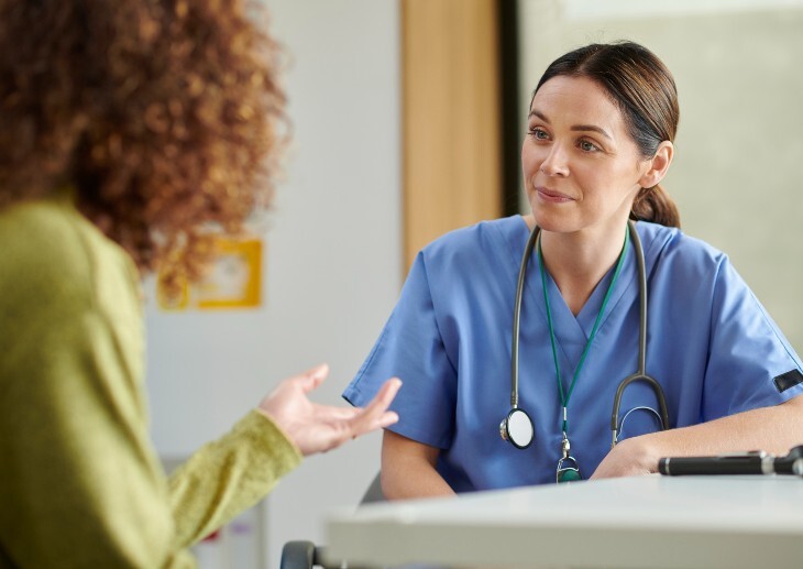 Female GP has consultation with patient