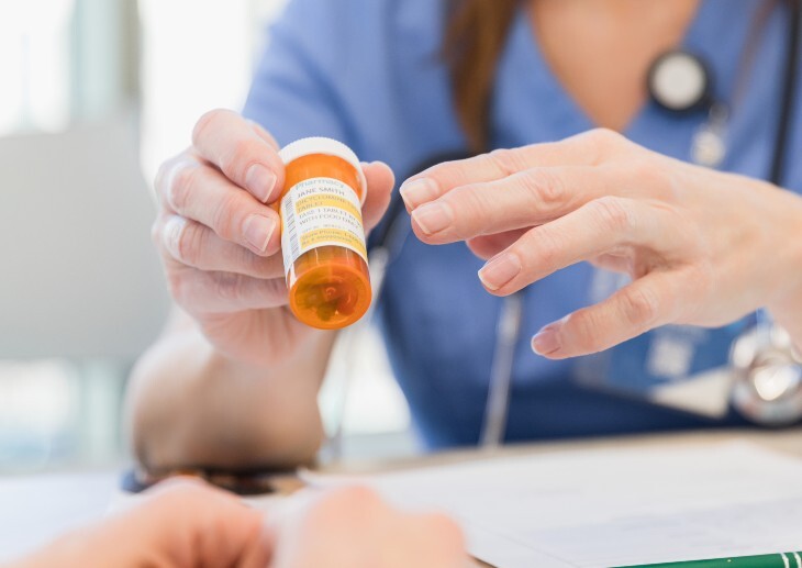 Female doctor discusses medication with patient