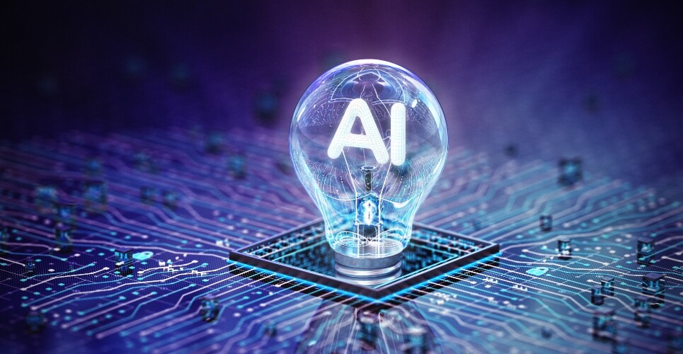 A glowing light bulb with AI in the centre, sitting on a microchip on a purple and blue circuit background to symbolise the rise of AI tools in infectious disease management presented at ESCMID