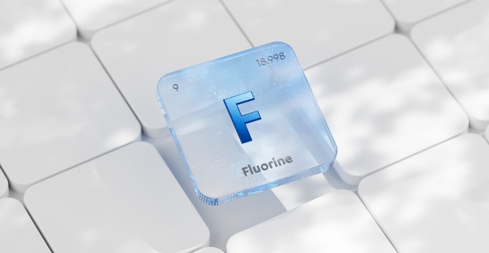 3D illustration of a blue periodic table element block for Fluorine (F), atomic number 9 and atomic mass 18.998, placed on a white keyboard-like background to illustrate the finding that fluorinated medicines are not associated with higher rates of adverse drug reactions despite fluorine being a forever chemical