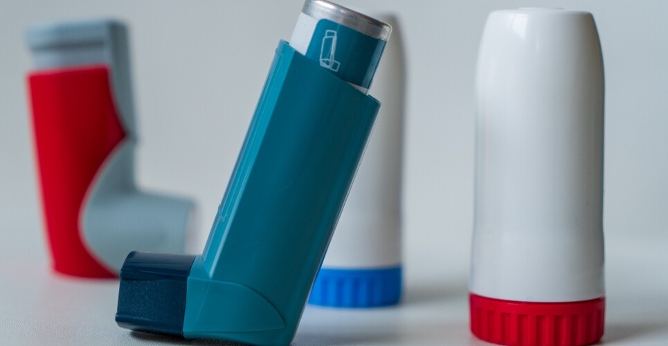A selection of four inhalers with salbutamol and budesonide-formoterol in the foreground to illustrate the redefining of paediatric asthma treatment based on Professor Andy Bush's research