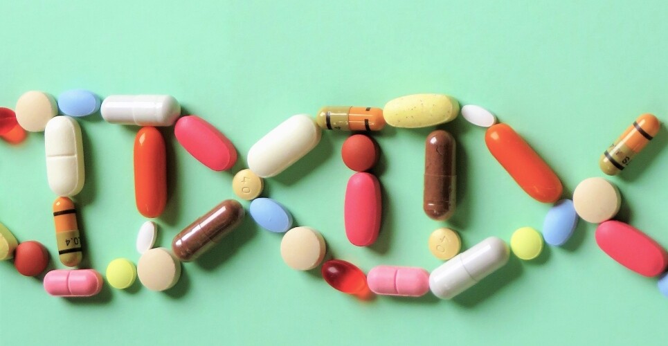 Tablets and capsules in the shape of a double helix on a green background to illustrate an RPS consultation on its new pharmacogenomic resource
