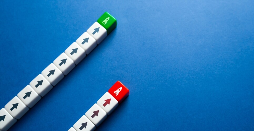 Two parallel lines of arrow-marked blocks on a blue background, one ending in a green block and the other in a red block with rocket icons, symbolising different performance outcomes for dupilumab versus tralokinumab in atopic dermatitis
