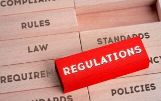 regulation written on red wooden block