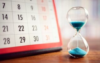 hourglass next to a calendar