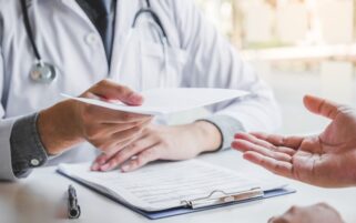 fit note being handed over by doctor
