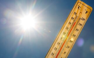 thermometer showing high temperature next to the sun