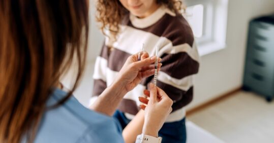 Flu vaccinations top last year by 500,000 but NHS ‘far from complacent’