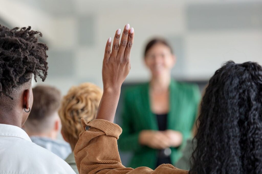 Students raising their hand as physician associate courses that have been approved are revealed